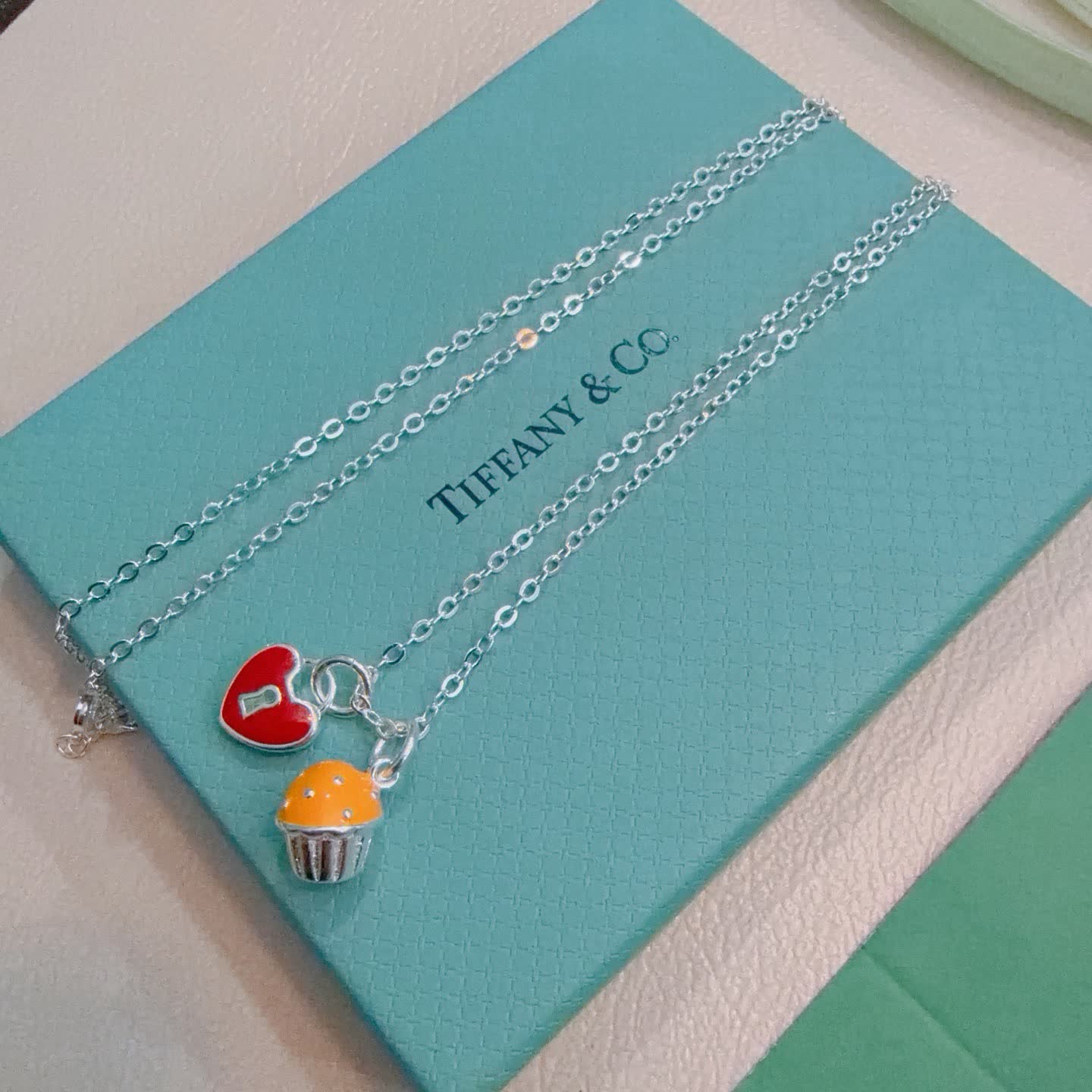 Tiffany & Co. Lock and Key Necklace with Cupcake Charm